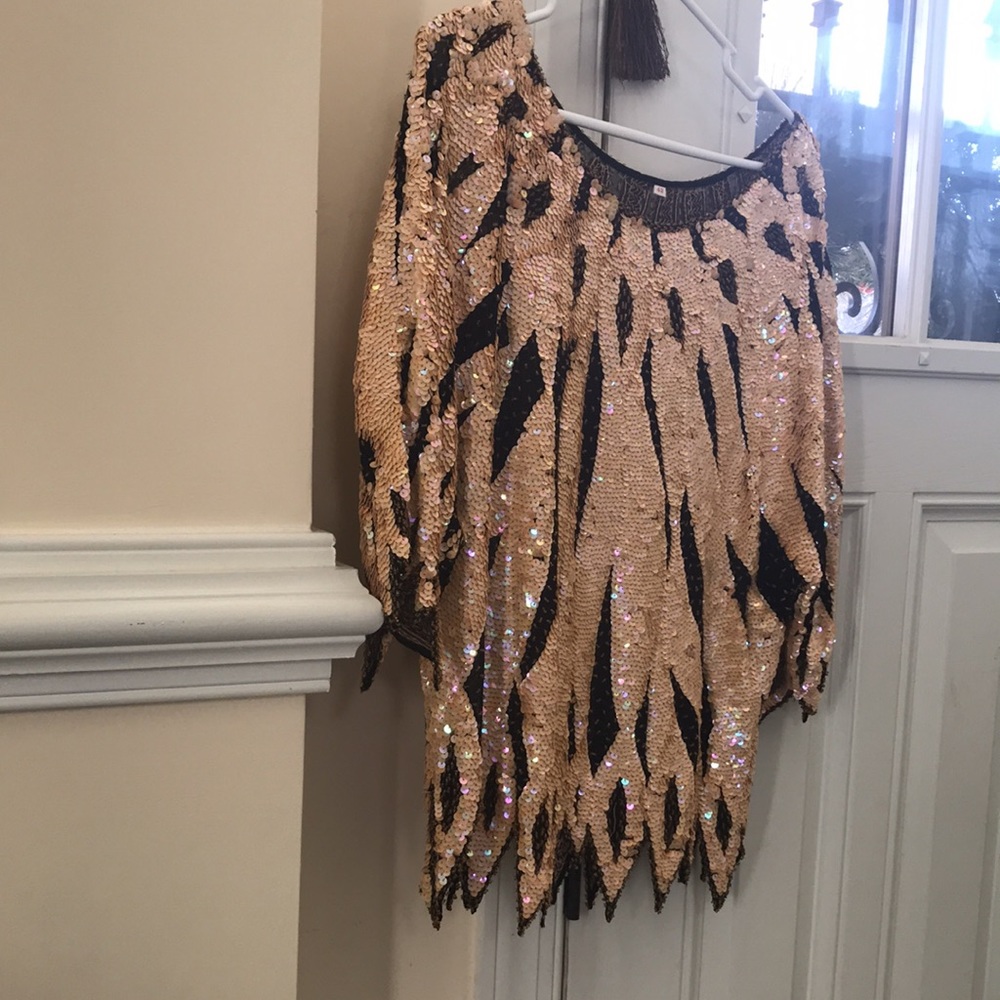 All sequines. You will L👀k INCREDIBLE W THIS TOP THAT GOES OVER YOUR HEAD 💗❤️